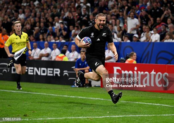 Dane Coles of New Zealand breaks with the ball to score his team's tenth try during the Rugby World Cup France 2023 match between New Zealand and...
