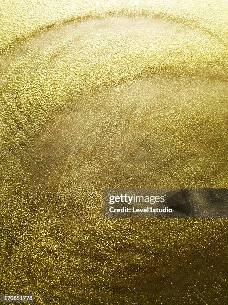 gold dust spangled densely - gold nail polish stock-fotos und bilder