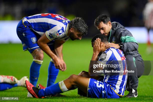 Akin Famewo of Sheffield Wednesday receives treatment during the Sky Bet Championship match between Sheffield Wednesday and Sunderland at...