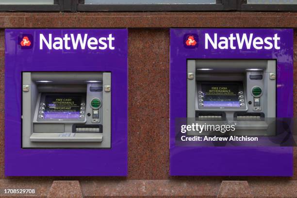 The NatWest Bank logo on their ATM machines on the 5th of October 2023 in Ashford, United Kingdom. National Westminster Bank also known as NatWest,...