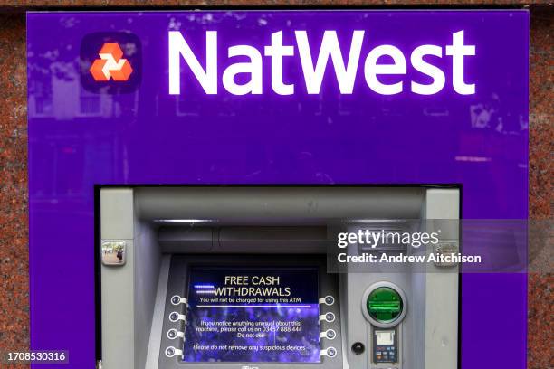 The NatWest Bank logo on their ATM machines on the 5th of October 2023 in Ashford, United Kingdom. National Westminster Bank also known as NatWest,...