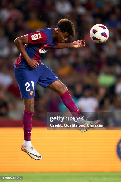 Lamine Yamal of FC Barcelona head a ball after the first goal of his team scored by Sergio Ramos of Sevilla FC during the LaLiga EA Sports match...
