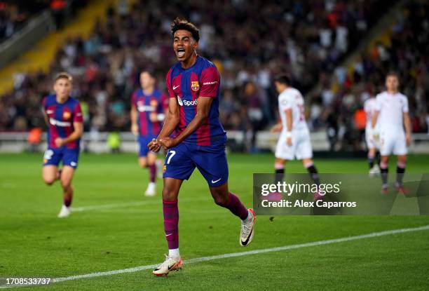 Lamine Yamal of Barcelona celebrates as Sergio Ramos of Sevilla scores an own-goal during the LaLiga EA Sports match between FC Barcelona and Sevilla...