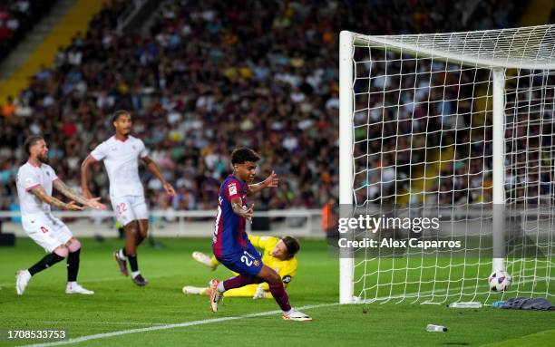 Lamine Yamal of Barcelona celebrates as Sergio Ramos of Sevilla scores an own-goal during the LaLiga EA Sports match between FC Barcelona and Sevilla...