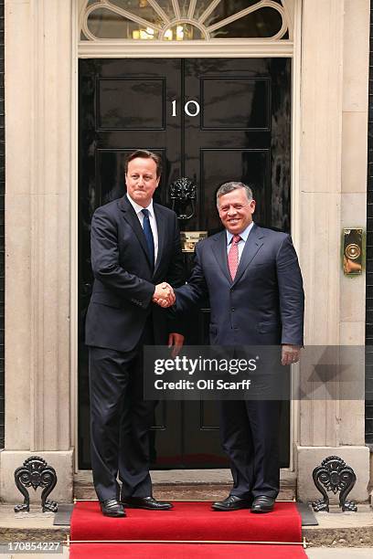 British Prime Minister David Cameron greets His Majesty King Abdullah II of Jordan outside Number 10 Downing Street on June 19, 2013 in London,...