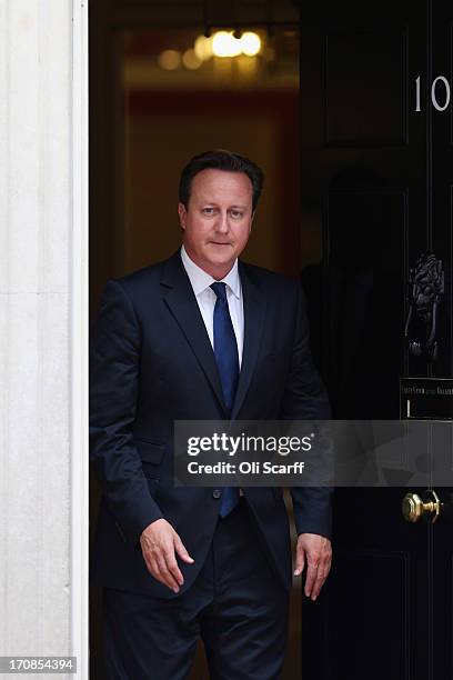 British Prime Minister David Cameron leaves Number 10 Downing Street to greet His Majesty King Abdullah II of Jordan on June 19, 2013 in London,...