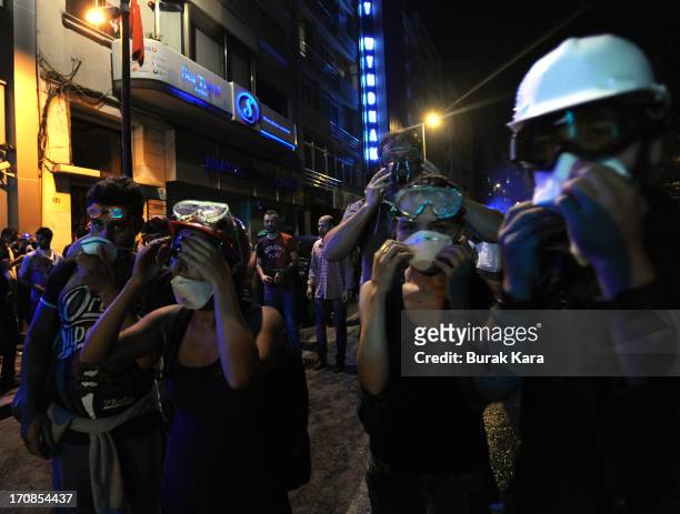 Antigovernment protests prepare their gas masks before the riots in Harbiye district, on June 15, 2013 Istanbul, Turkey. Protests which started over...