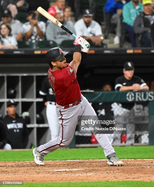 Gabriel Moreno of the Arizona Diamondbacks hits a sac fly against the Chicago White Sox at Guaranteed Rate Field on September 26, 2023 in Chicago,...