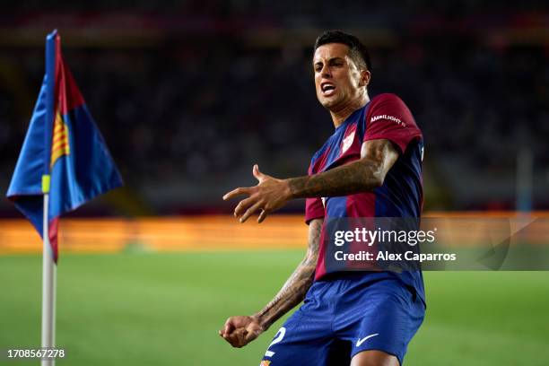 Joao Cancelo of FC Barcelona celebrates after Sergio Ramos of Sevilla FC scored an own goal during the LaLiga EA Sports match between FC Barcelona...