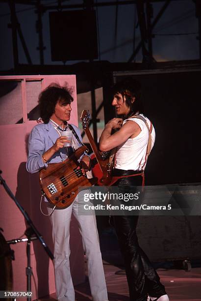 Bill Wyman and Ron Wood of the Rolling Stones are photographed are photographed on June 25-26, 1982 backstage at Wimbley Stadium in London, England....