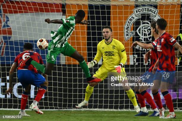 Aris Limassol's Gabonese defender Alex Moucketou-Moussounda heads the ball to score his team's first goal during the UEFA Europa League Group C...