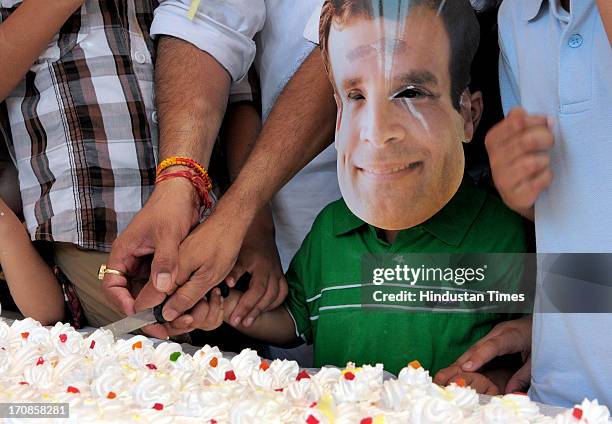 Children wearing mask of Congress Vice President Rahul Gandhi as they celebrate his 43rd birthday near the historical Hawa Mahal on June 19, 2013 in...