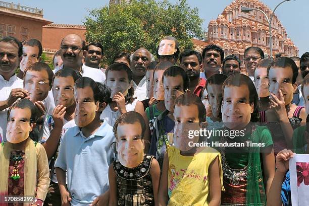 Children wear mask of Congress Vice President Rahul Gandhi as they celebrate his 43rd birthday near the historical Hawa Mahal on June 19, 2013 in...