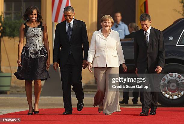 First Lady Michelle Obama, U.S. President Barack Obama, German Chancellor Angela Merkel and her husband Joachim Sauer attend the dinner given in...