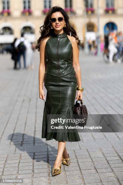 Guest is seen wearinga leather zipper green top and midi leather skirt outside Giambattista Valli show during the Womenswear Spring/Summer 2024 as...