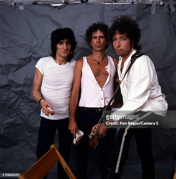 Bob Dylan, Ron Wood and Keith Richards of the Rolling Stones are photographed backstage at Live Aid on July 13, 1985 in JFK Stadium in Philadelphia,...