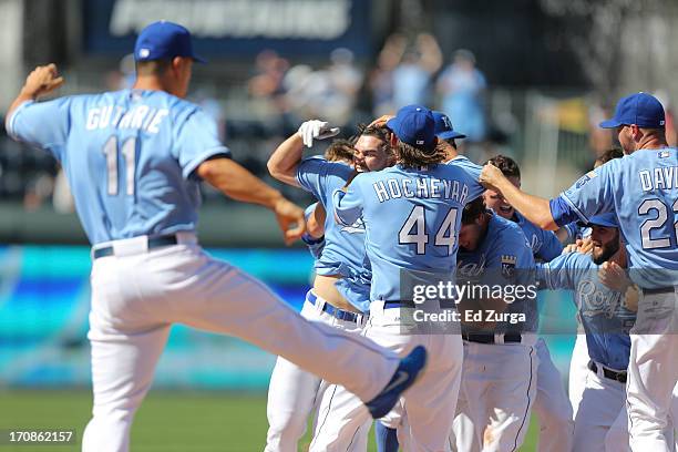 Eric Hosmer of the Kansas City Royals celebrates with teammates after hitting a game-winning RBI single during a game against the Detroit Tigers at...