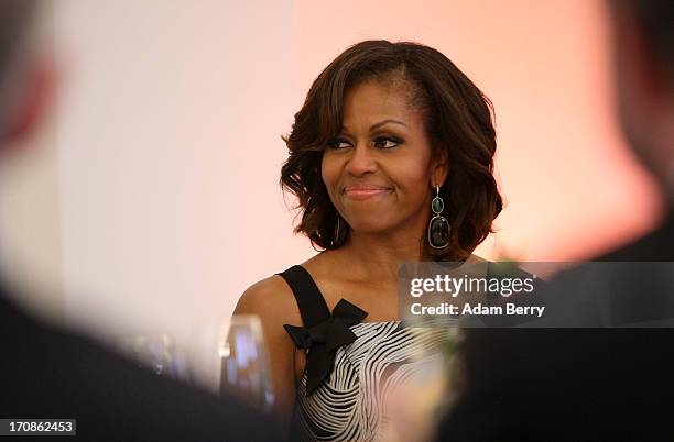 First Lady Michelle Obama arrives for a dinner at the Orangerie at Schloss Charlottenburg palace on June 19, 2013 in Berlin, Germany. Obama is...
