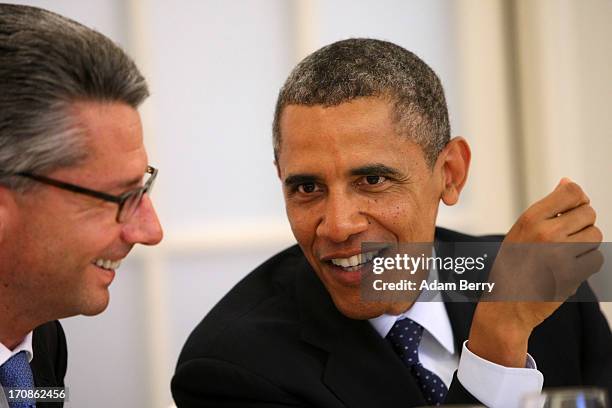 Ulrich Grillo, president of the Federation of German Industries , speaks to U.S. President Barack Obama at a dinner at the Orangerie at Schloss...