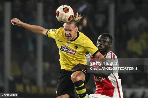 S Croatian defender Domagoj Vida heads the ball as he fights for the ball with Ajax's Dutch forward Brian Brobbey during the UEFA Europa League 1st...