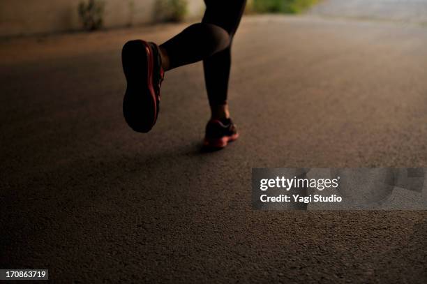 silhouette of female feet to the jogging - foot foto e immagini stock