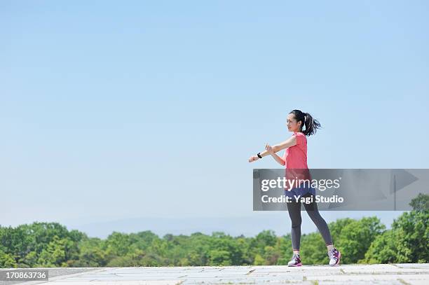 woman having a warm-up for a run. - woman stretching ストックフォトと画像