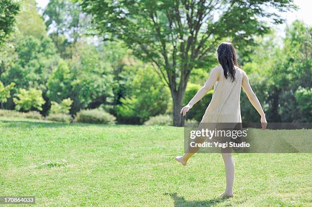 woman walking in nature - woman walking studio back stock pictures, royalty-free photos & images