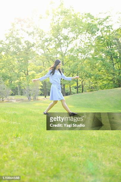 woman walking in nature,smiling - sunny days stock-fotos und bilder