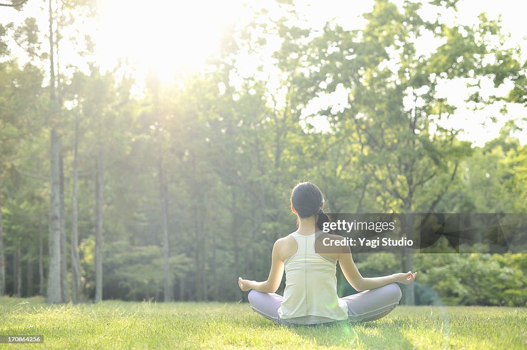 Woman doing yoga in nature