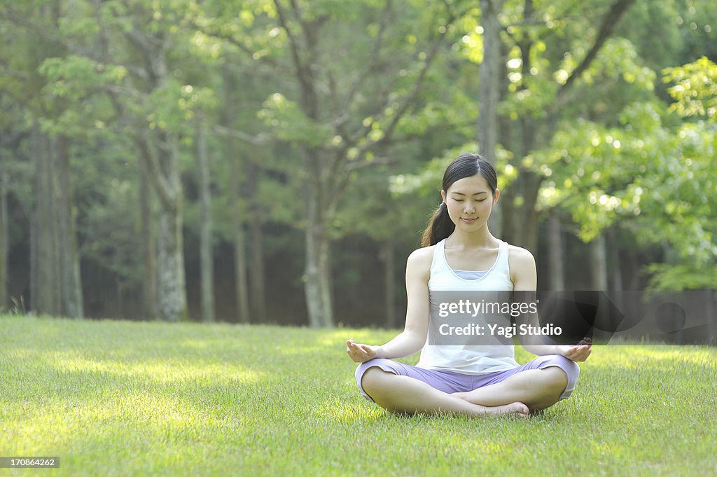 Woman doing yoga in nature