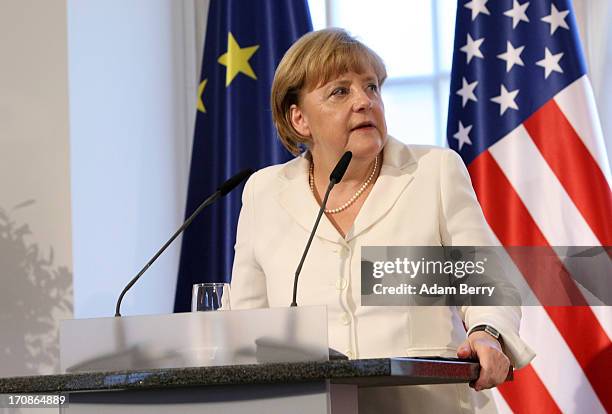 German Chancellor Angela Merkel speaks during a dinner at the Orangerie at Schloss Charlottenburg palace on June 19, 2013 in Berlin, Germany. U.S....