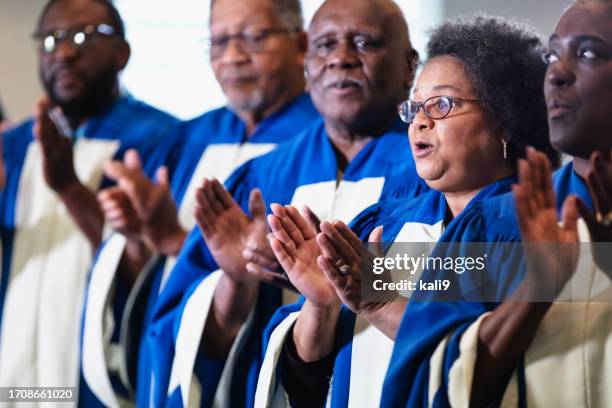 group of black men and women singing in church choir - social gospel stock pictures, royalty-free photos & images