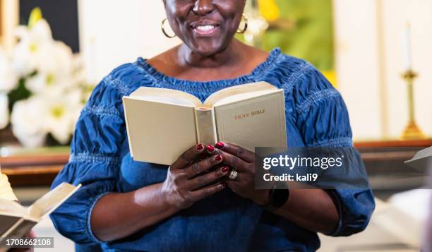 mature black woman in group bible study - holy book stock pictures, royalty-free photos & images