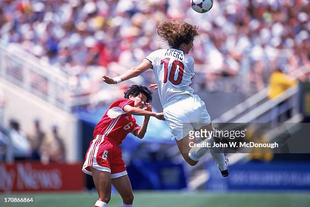 World Cup Final: USA Michelle Akers in action, head ball vs China Zhao Lihong at Rose Bowl Stadium. Pasadena, CA 7/10/1999 CREDIT: John W. McDonough