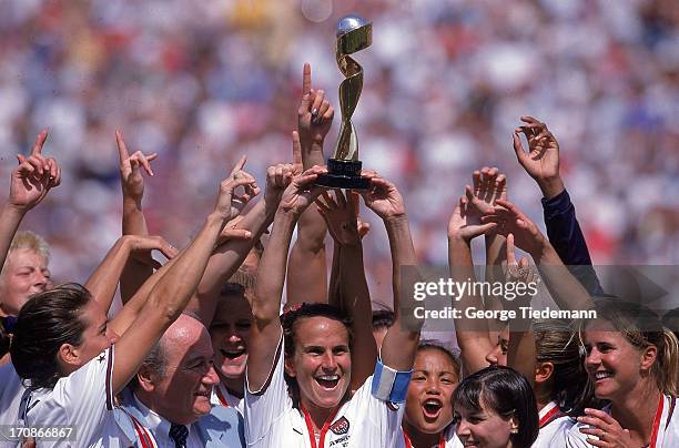 World Cup Final: Overall view of Team USA players victorious with trophy on field after winning match vs China at Rose Bowl Stadium. Pasadena, CA...