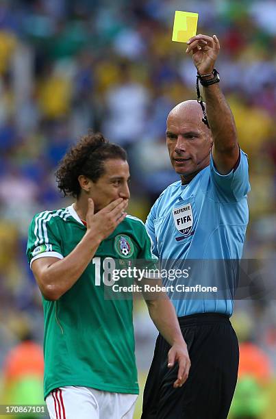 Andres Guardado of Mexico is shown a yellow card by Referee Howard Webb during the FIFA Confederations Cup Brazil 2013 Group A match between Brazil...