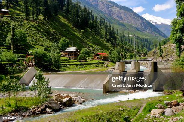 mini hydro power plant for local electricity production and small dam for water storage. - hydroelectric power station stock pictures, royalty-free photos & images