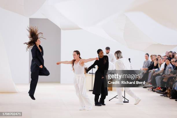 Dancers perform on the runway during the Issey Miyake Womenswear Spring/Summer 2024 show as part of Paris Fashion Week on September 29, 2023 in...