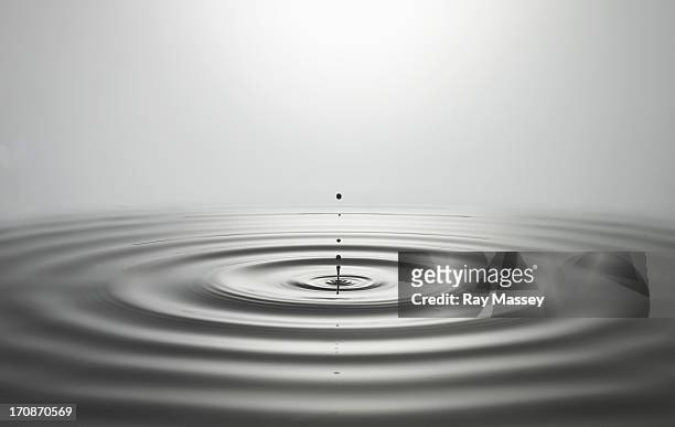 droplet impact - rippled stock pictures, royalty-free photos & images