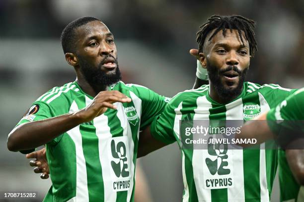 Aris Limassol's Gabonese forward Shavy Babicka celebrates with teammates after scoring his team's second goal during the UEFA Europa League Group C...