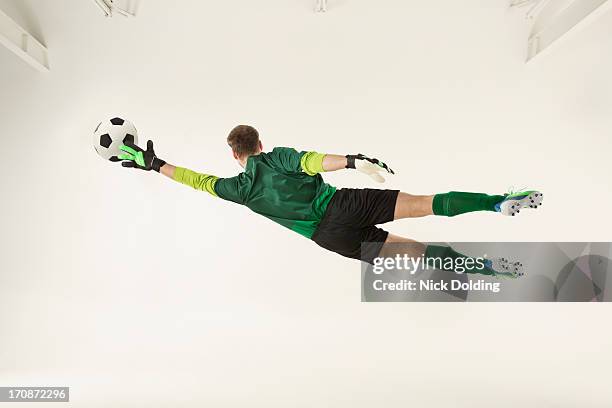 flying sports, football 18 - football goal keeper stock pictures, royalty-free photos & images