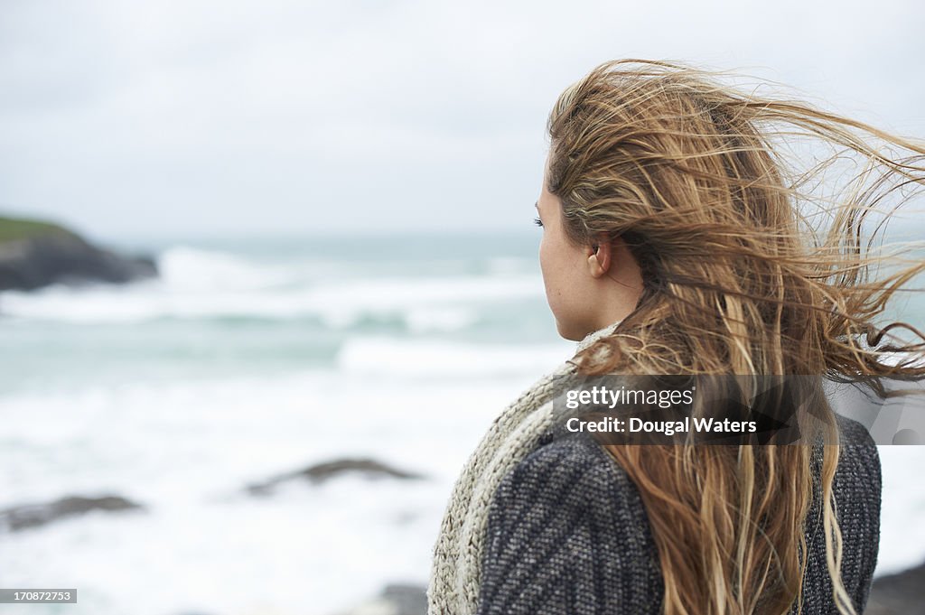 Woman looking out to sea.