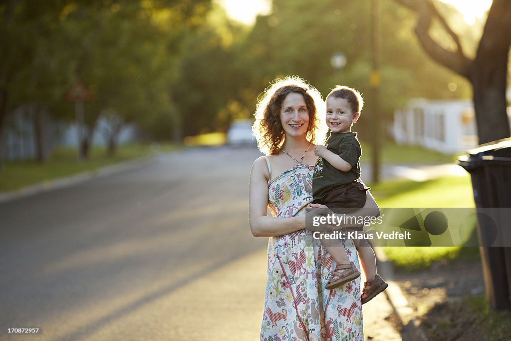 Mother & son laughing in the sunset