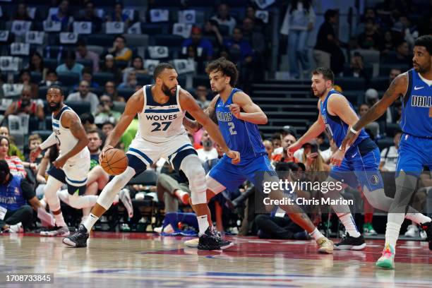 Rudy Gobert of the Minnesota Timberwolves handles the ball against the Dallas Mavericks as part of 2023 NBA Global Games Abu Dhabi at Etihad Arena on...