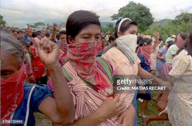 Un grupo de mujeres indigenas pertenecientes a la base civil de apoyo del Ejercito Zapatista de Liberacion Nacional marchan por el poblado de La...