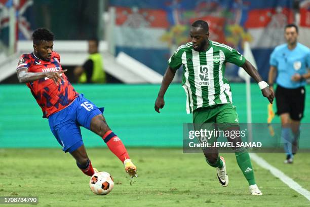 Rangers' Ecuadorian midfielder Jose Cifuentes fights for the ball with Aris Limassol's Senegalese forward Yannick Gomis during the UEFA Europa League...