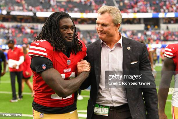 San Francisco 49ers wide receiver Brandon Aiyuk celebrates with general manager John Lynch after the NFL game between the San Francisco 49ers and the...