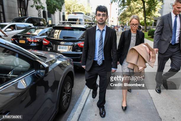Adam Yedidia, a former employee at FTX Cryptocurrency Derivatives Exchange, center, exits court in New York, US, on Thursday, Oct. 5, 2023. Former...