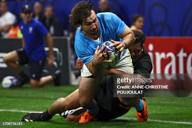 Uruguay's blindside flanker Manuel Ardao dives across the line to score a try, later disallowed by the referee, during the France 2023 Rugby World...