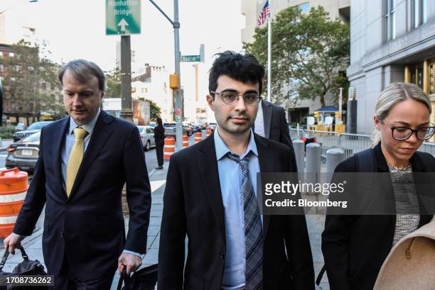 Adam Yedidia, a former employee at FTX Cryptocurrency Derivatives Exchange, center, exits court in New York, US, on Thursday, Oct. 5, 2023. Former...